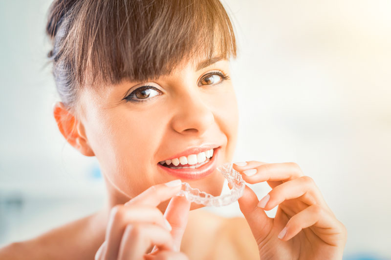 Women with her Invisalign's in Mississauga, Ontario
