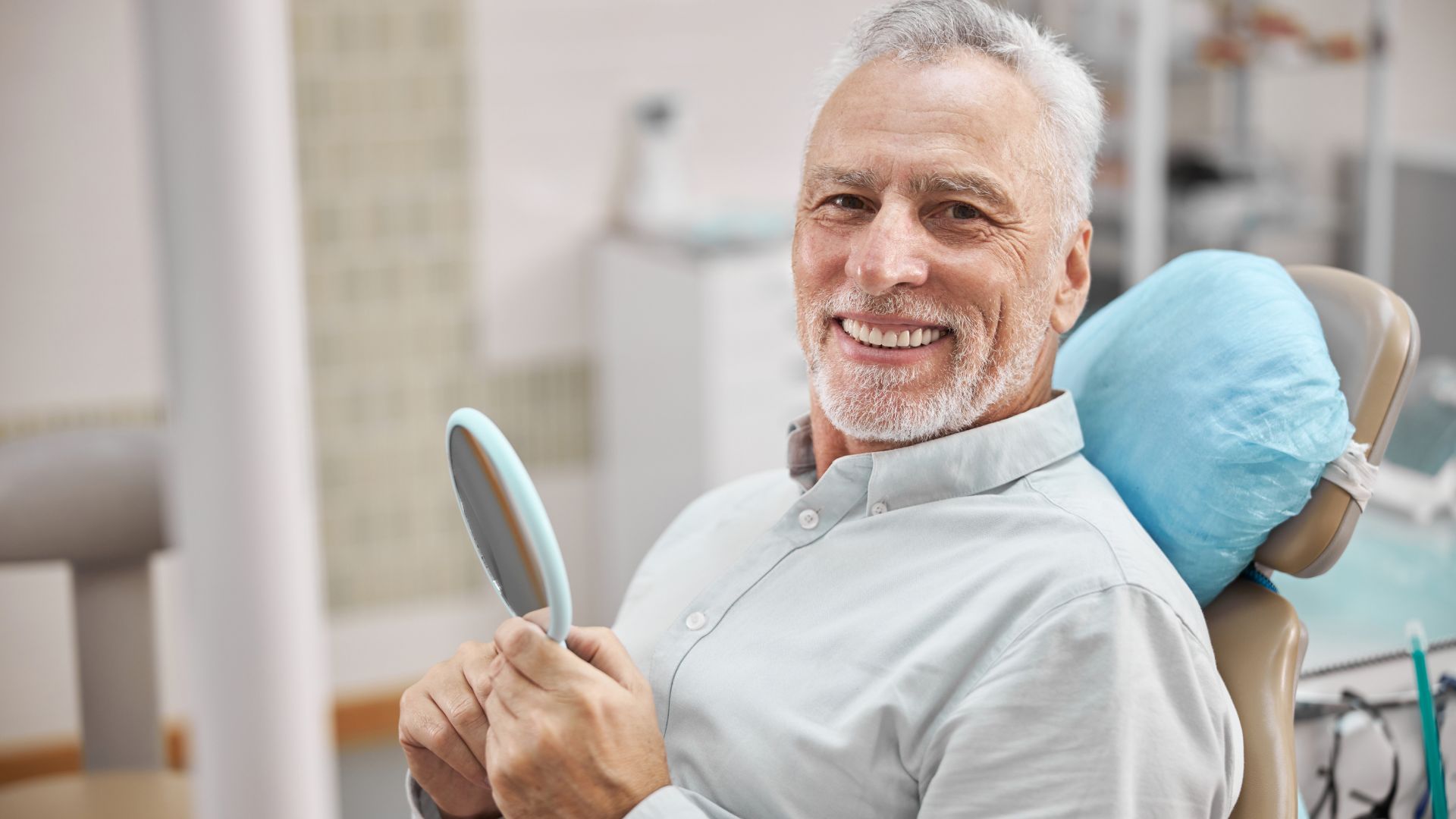 Old Man Smiling At Dental Clinic